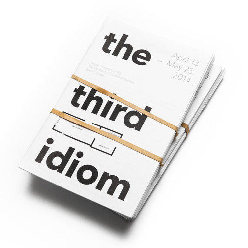 A stack of booklets reading the third idiom wrapped in rubber bands